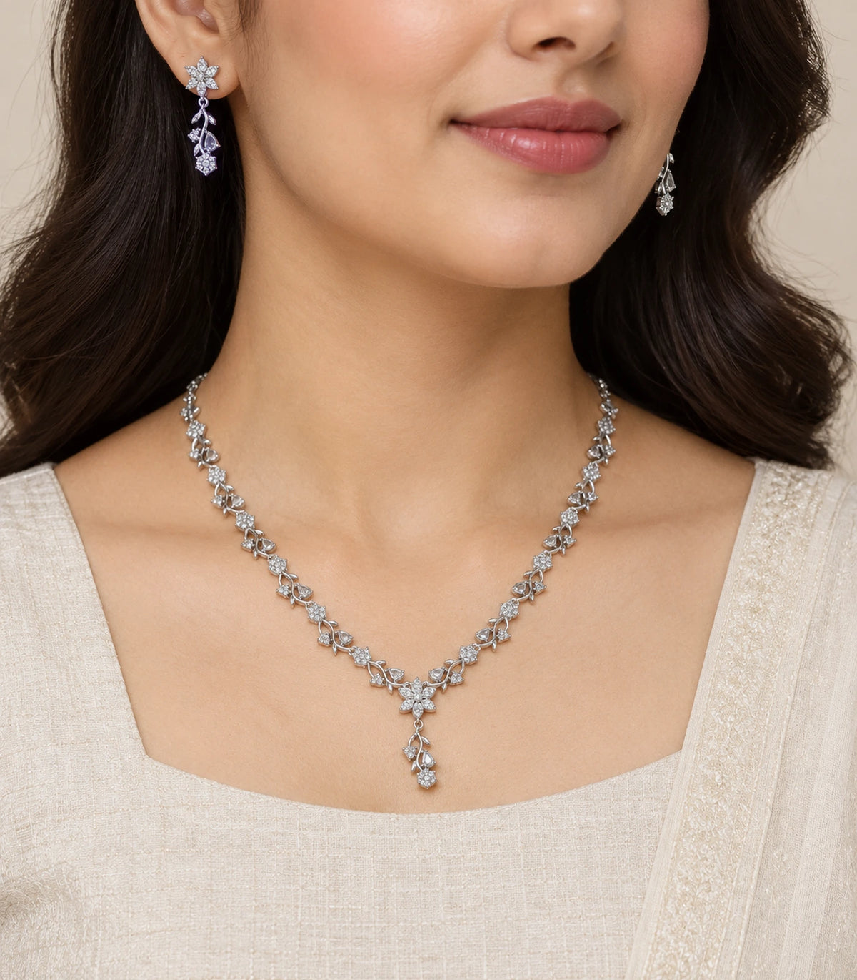 Silver-tone clear floral Y-drop necklace set worn with an ivory outfit