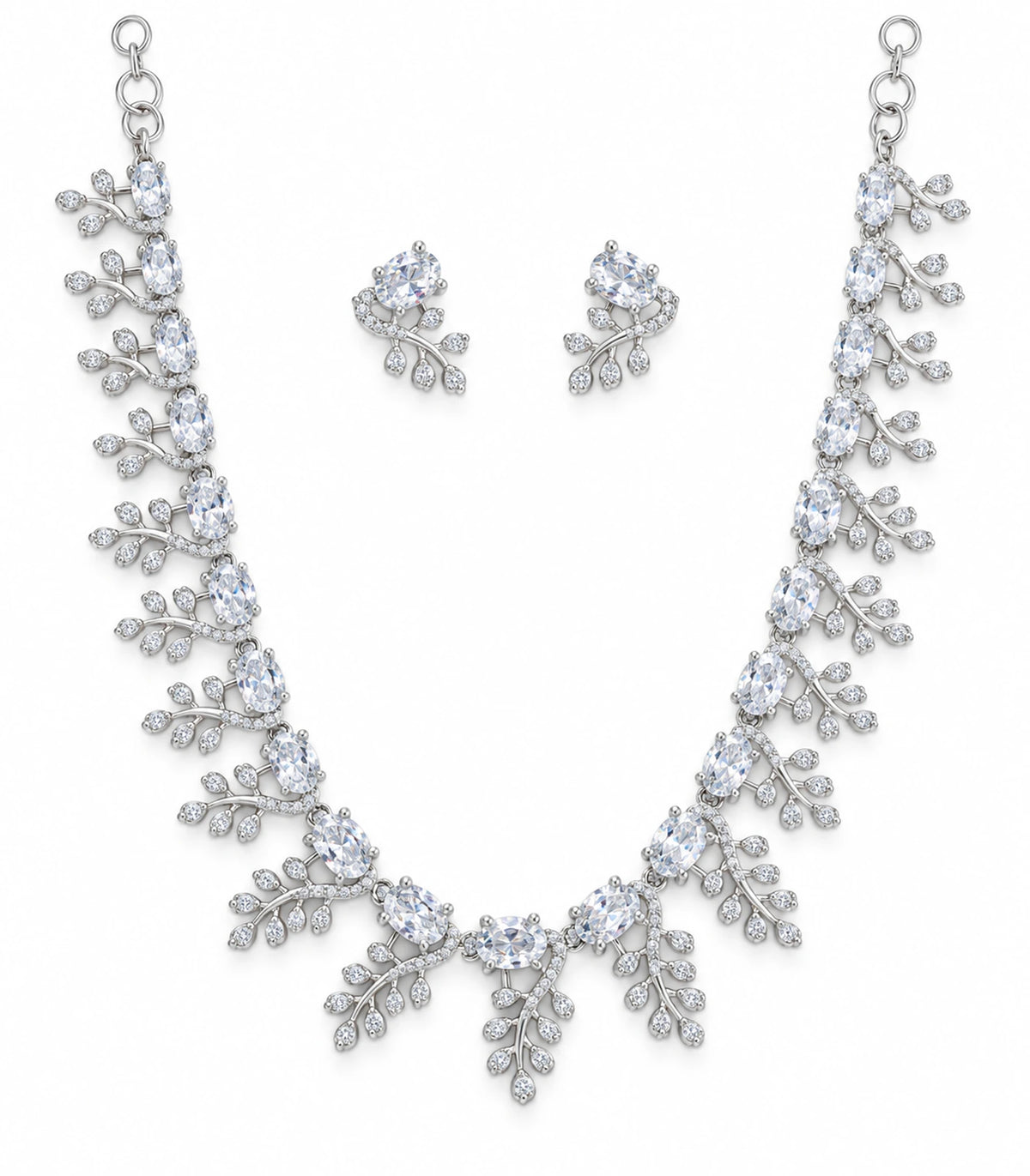 Complete silver-tone clear leaf-cluster necklace and matching two earrings on white