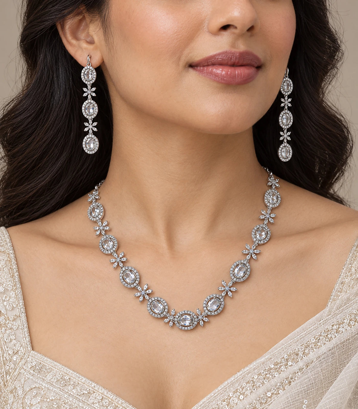 Silver clear oval floral necklace set worn with matching earrings