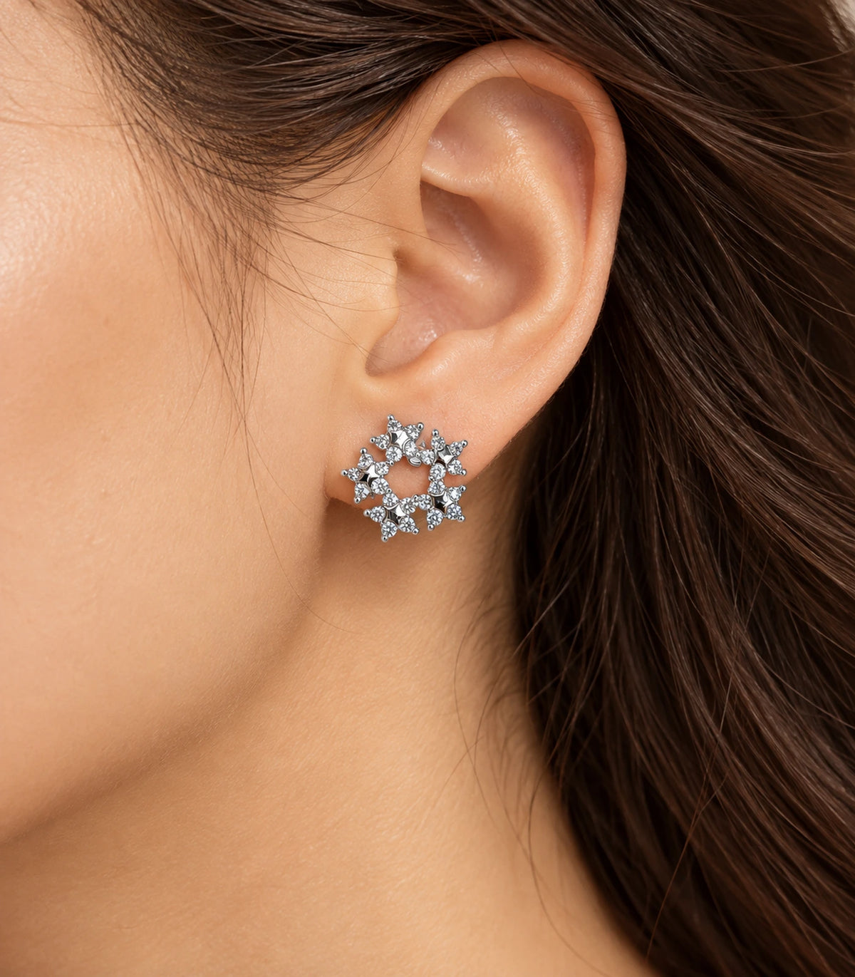 Silver-tone butterfly wreath stud earring worn in a distinct styled side composition