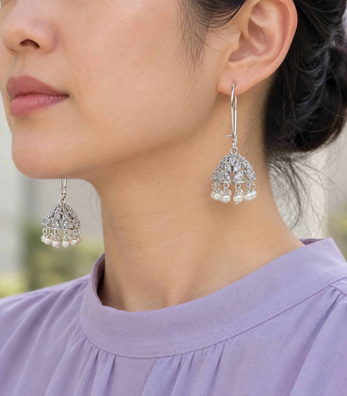 JIMIKI Crystal Leaf Pearl Hoop Jhumka Earrings - Silver earring worn by a model #color_silver