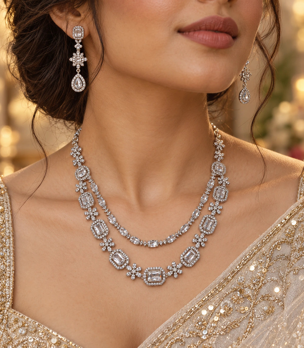 Silver-tone geometric necklace set in a warm editorial portrait