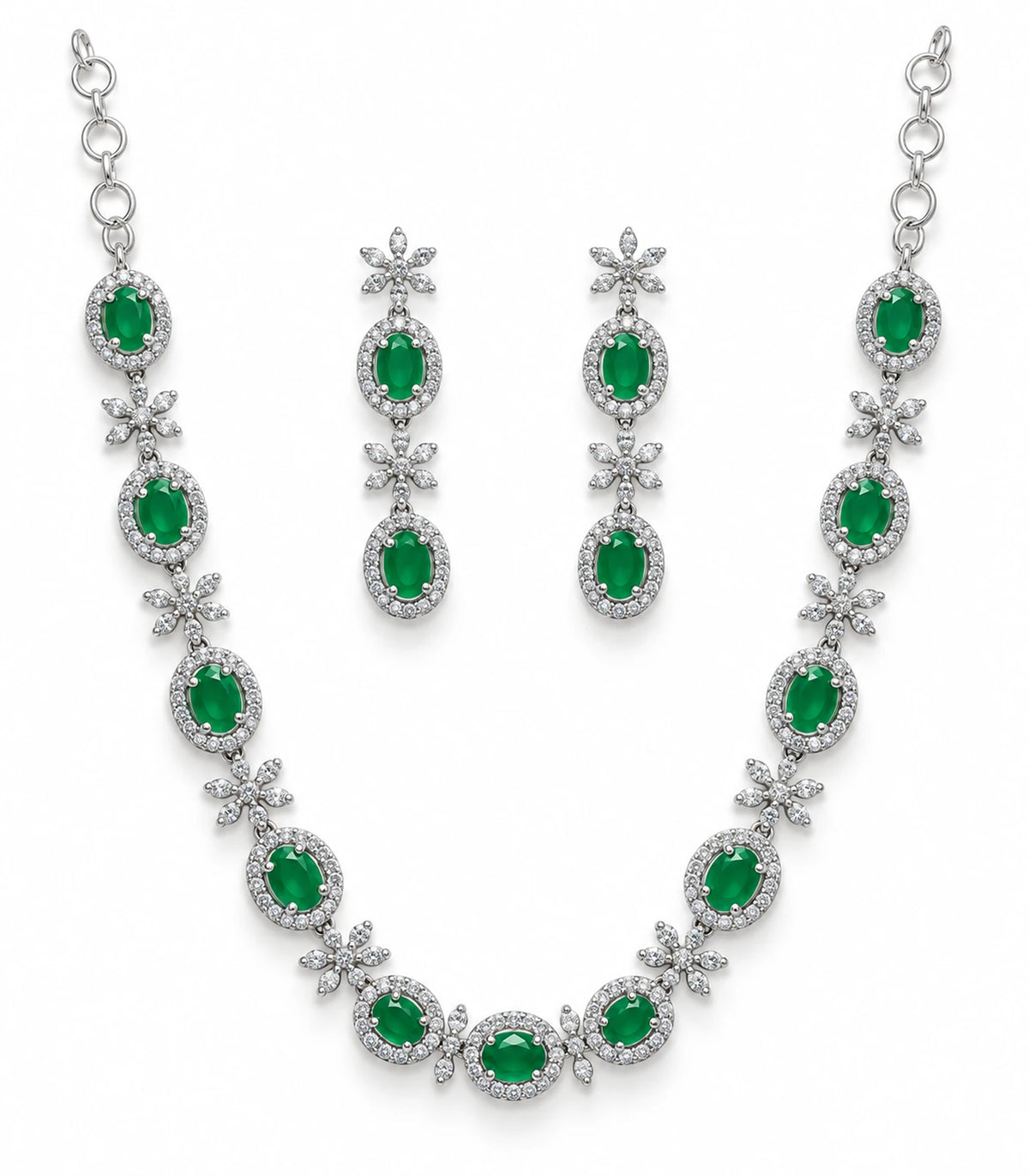 Silver-tone emerald green oval and floral necklace with matching pair of drop earrings on white