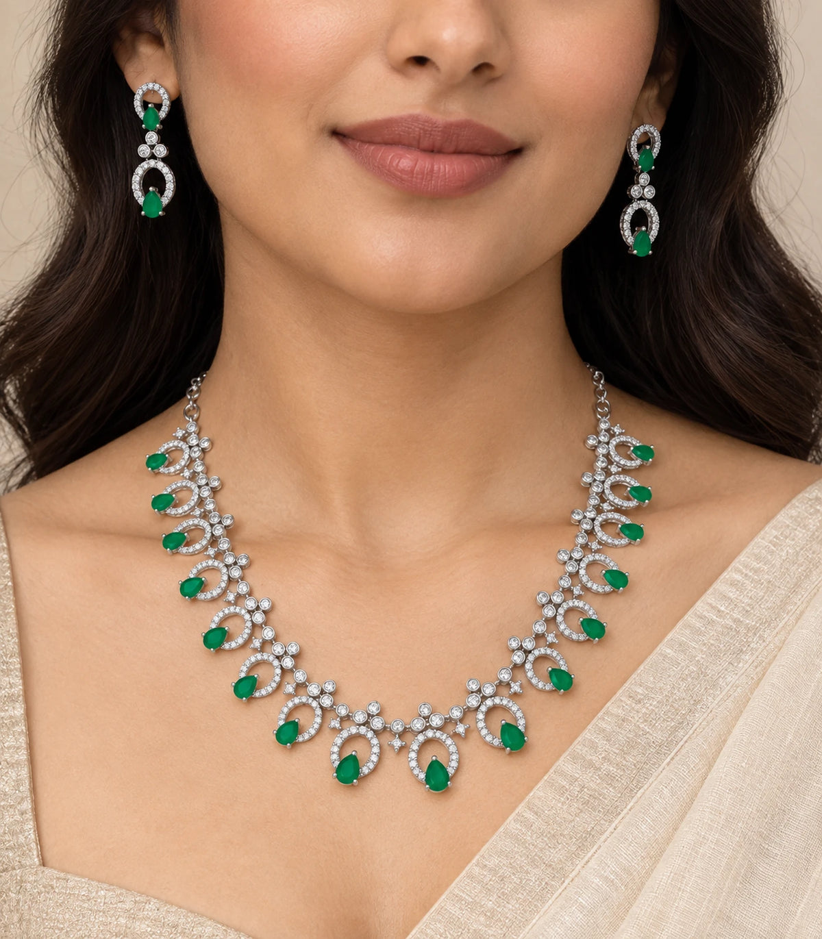 Silver emerald teardrop fringe necklace set worn with matching drop earrings