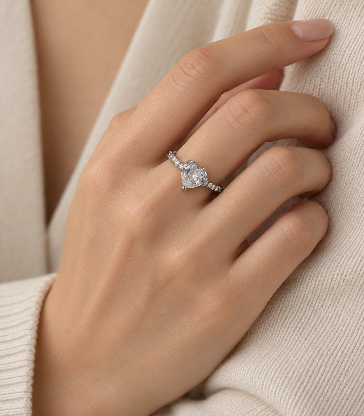 Silver-tone heart crystal pavé ring worn in a distinct editorial hand pose