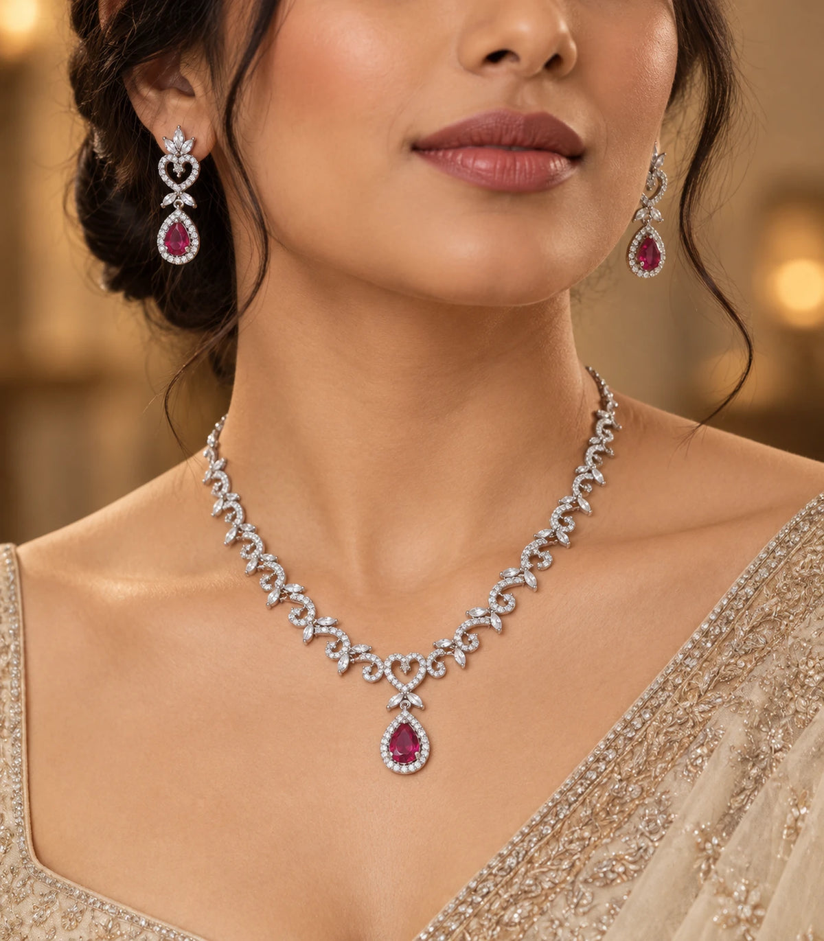 Silver magenta heart teardrop necklace set worn with a gold-tone outfit