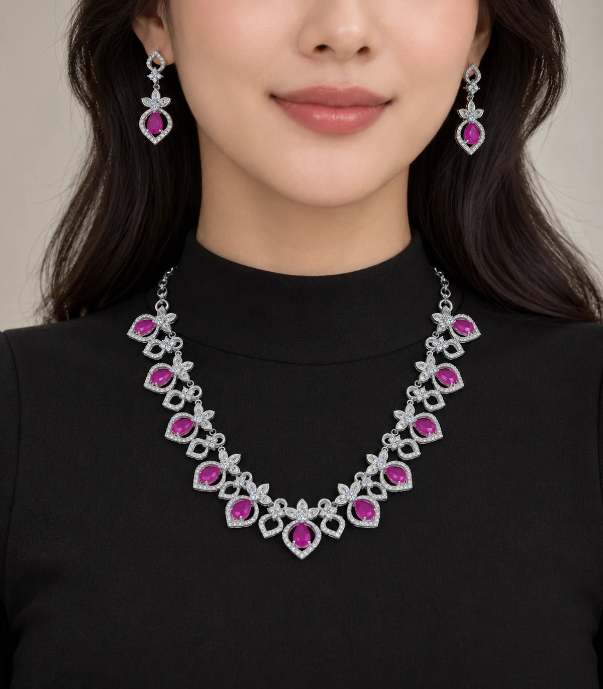 Silver-tone magenta necklace and matching earrings styled with a black outfit