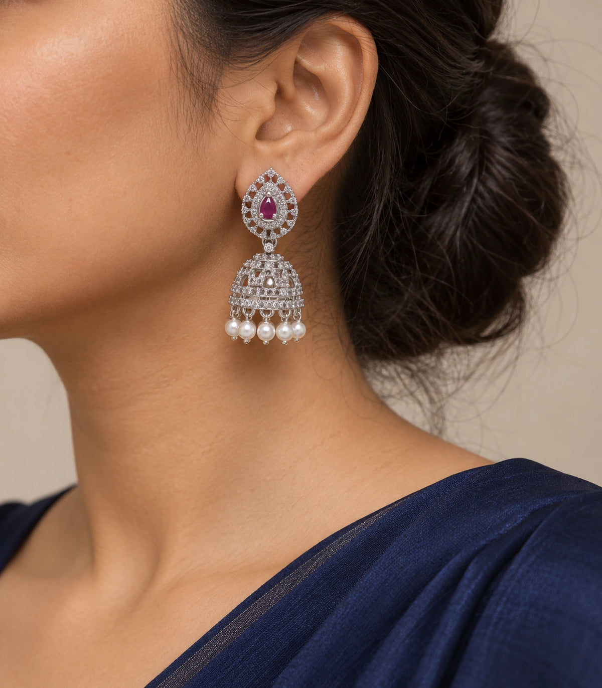 Silver-tone magenta openwork pearl-fringe jhumka earring worn at the ear