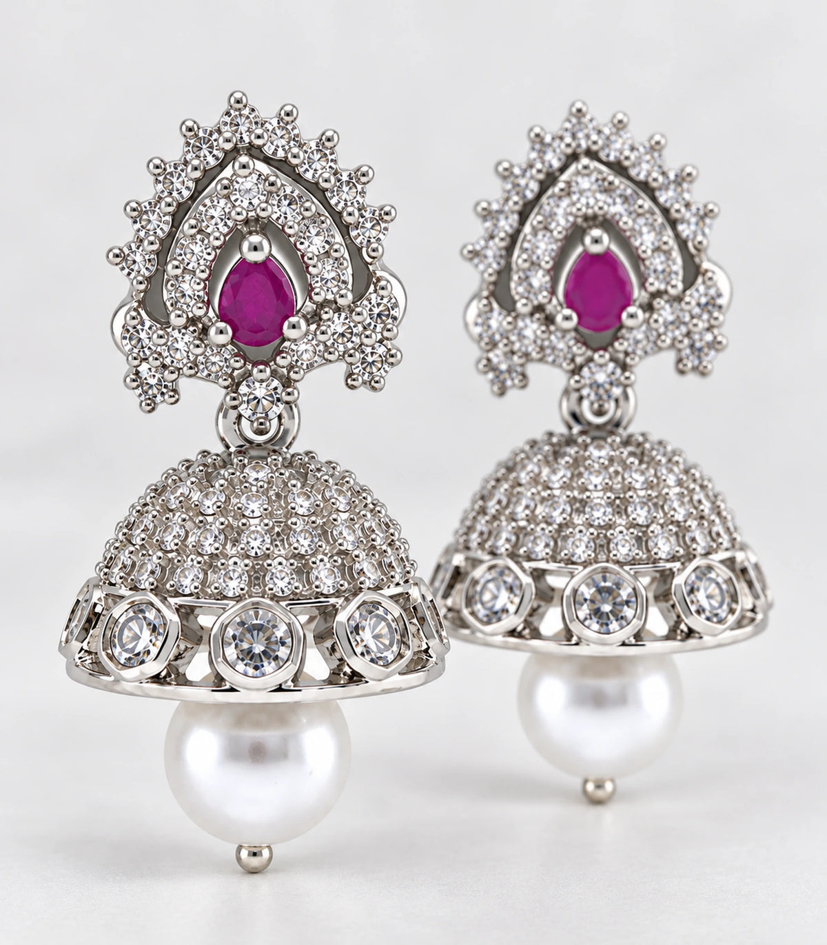 Silver Magenta Sunburst Teardrop Pearl Jhumka Earrings – editorial flat lay