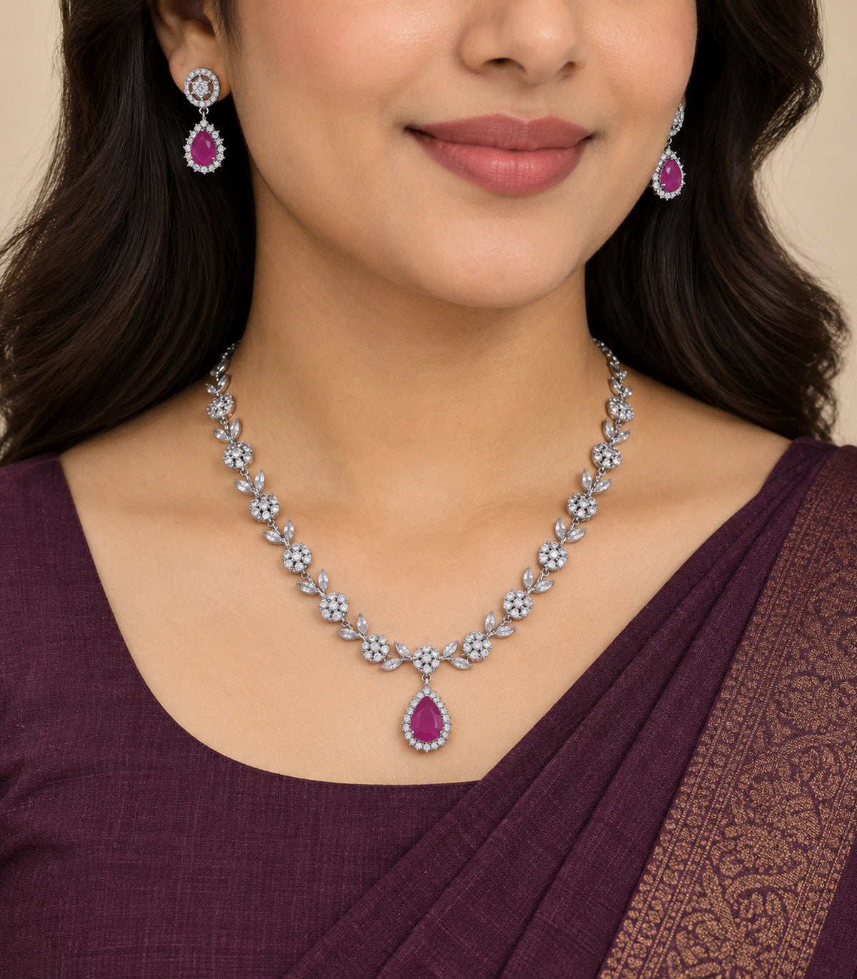 Silver Magenta Teardrop Crystal Necklace Set worn with a purple outfit