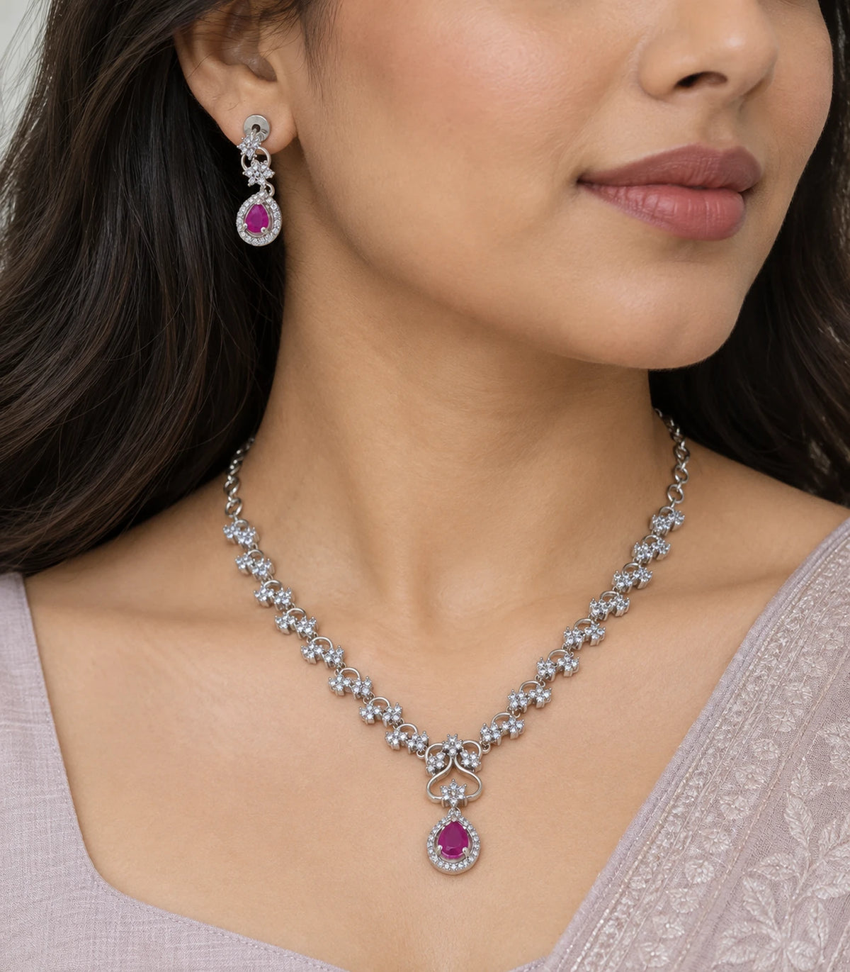 Close view of the Silver Magenta Teardrop Necklace Set worn with matching earring