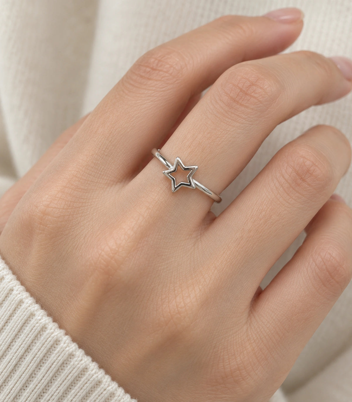 Silver Open Star Minimal Ring worn on a finger