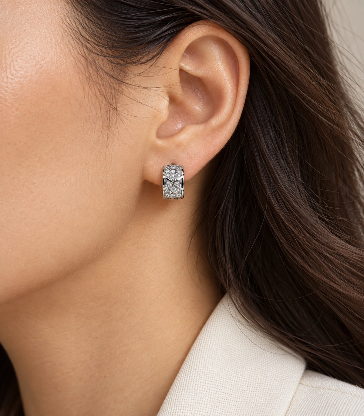 JIMIKI Silver Pave Bow Cross Huggie Earrings — editorial worn styling #color_silver