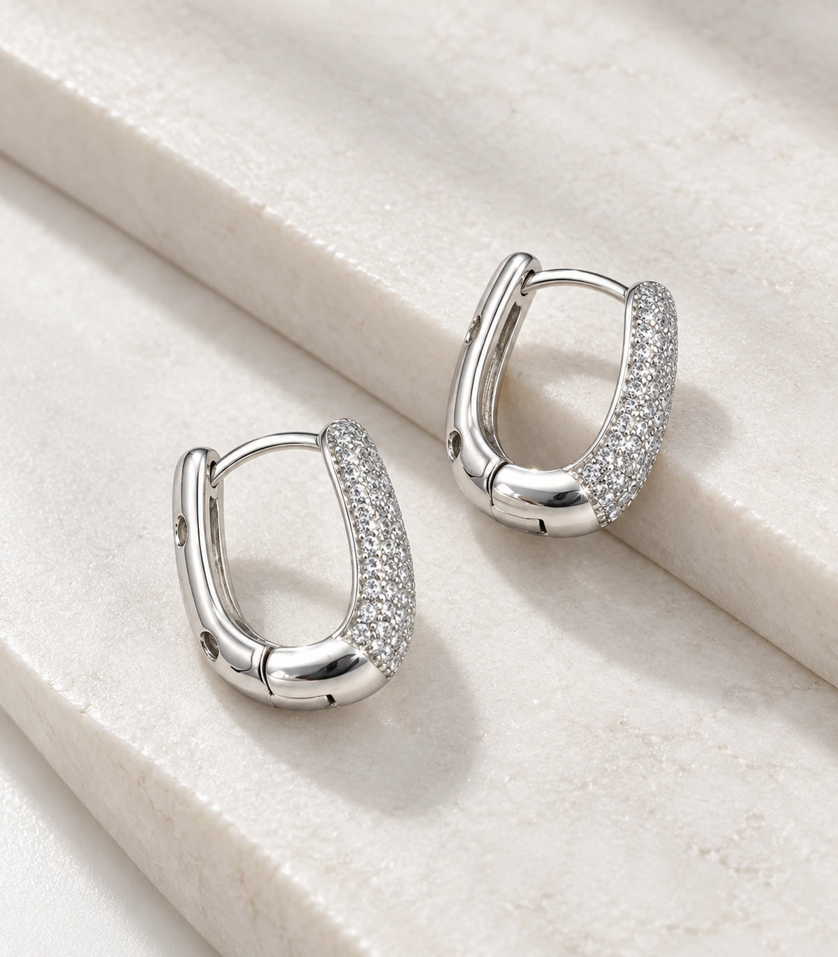 JIMIKI Pave Bar Huggie Hoop Earrings in Silver - editorial-flatlay #color_silver