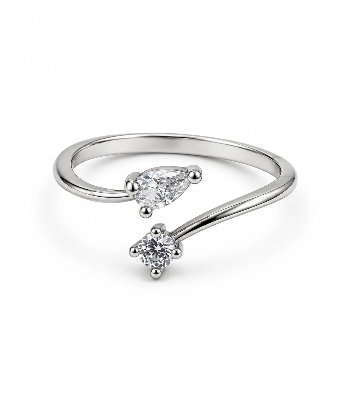 Silver-tone pear and round clear crystal bypass ring on a white background