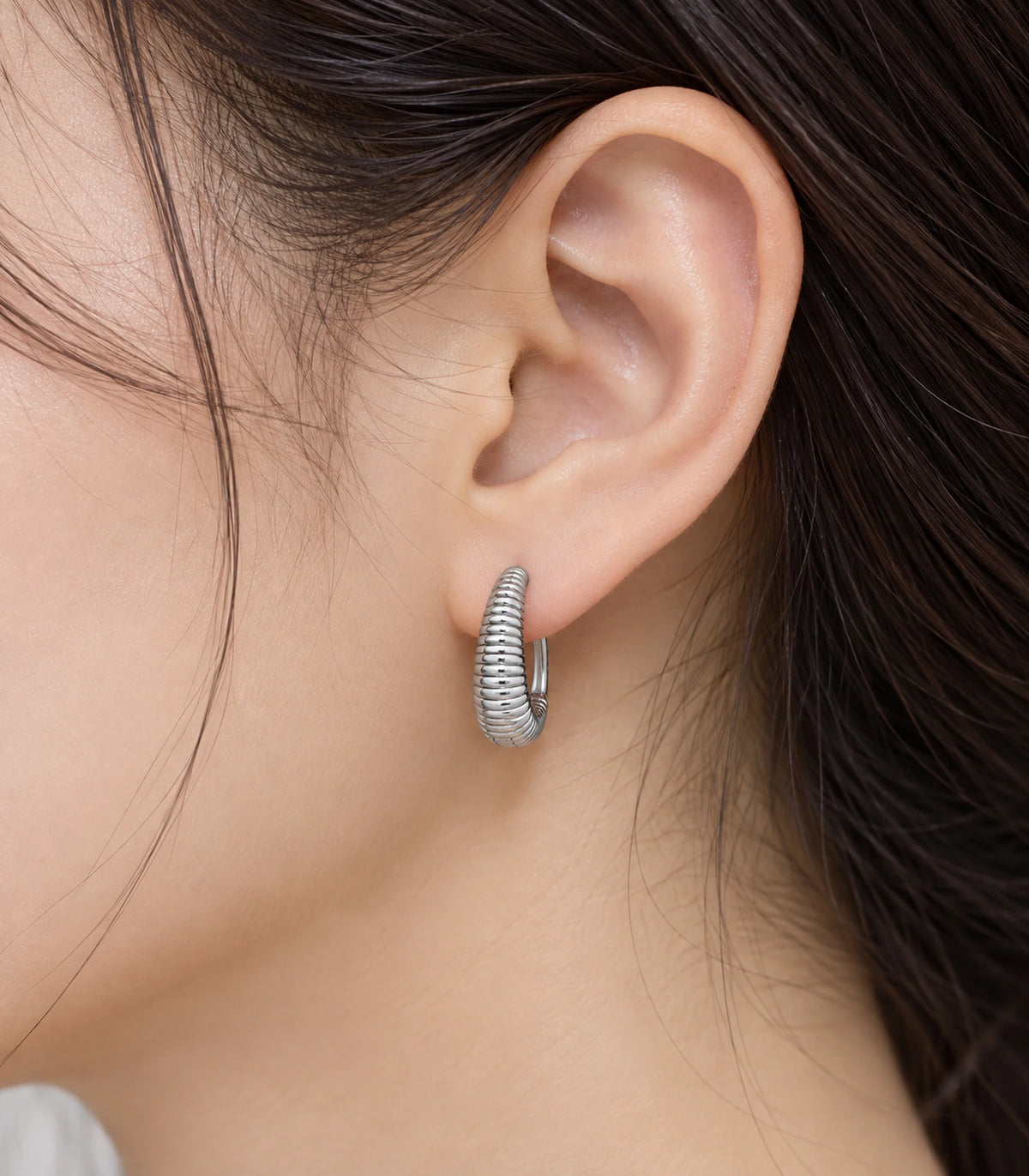 JIMIKI Ribbed Teardrop Hoop Earrings in Silver - editorial model #color_silver