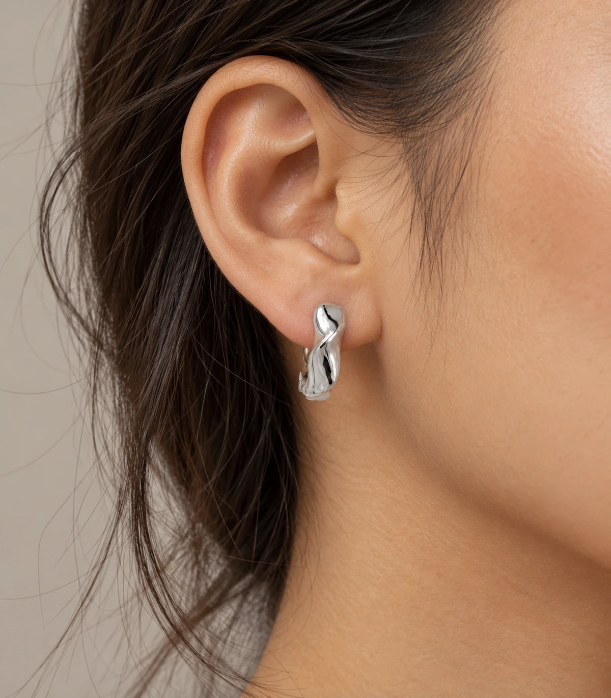 JIMIKI Silver Sculpted Twist Hoop Earrings - editorial model #color_silver