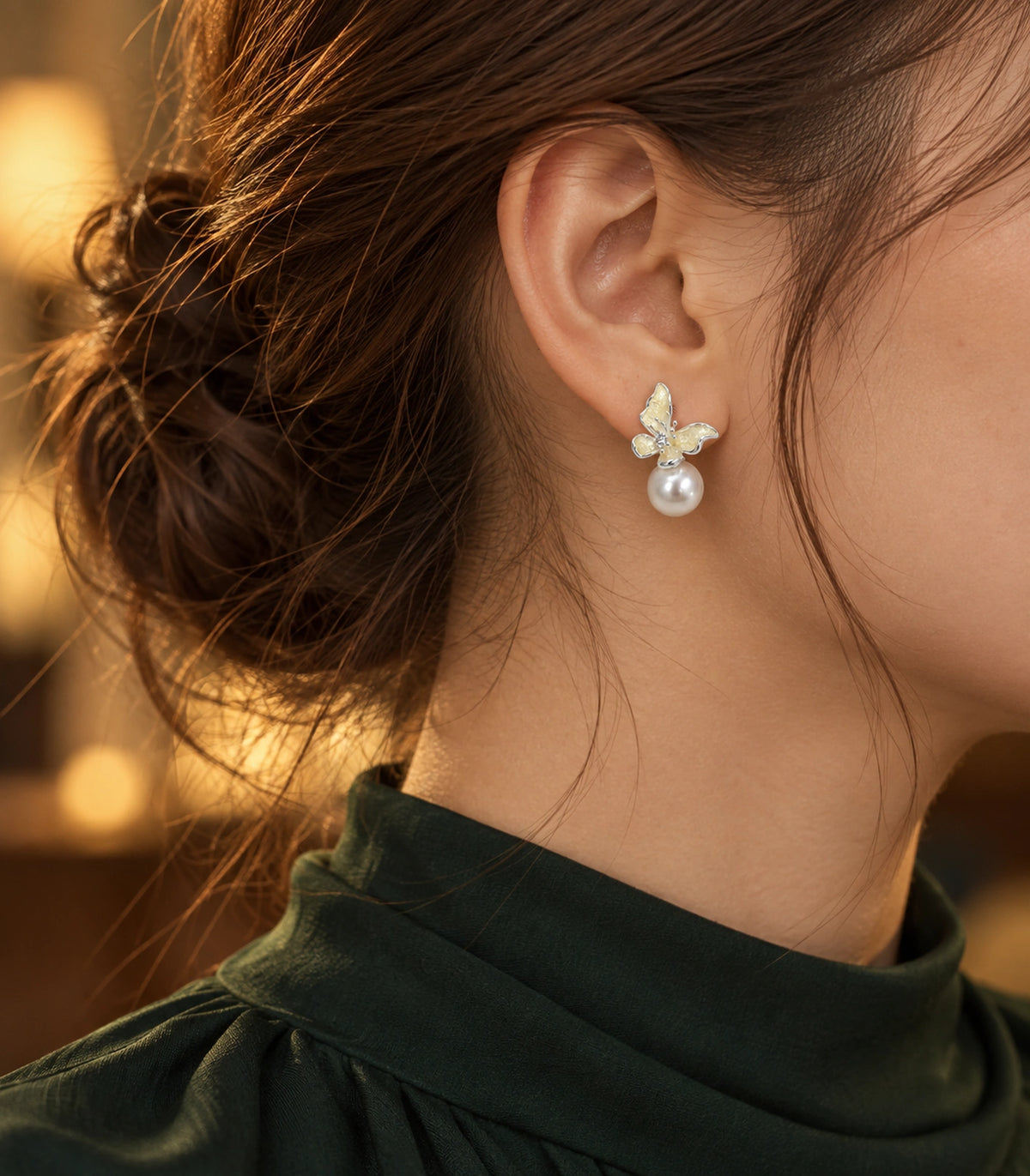 JIMIKI Asymmetric Butterfly Pearl-Style Earrings in Cream / silver-tone / white, editorial model view #color_cream / silver-tone / white