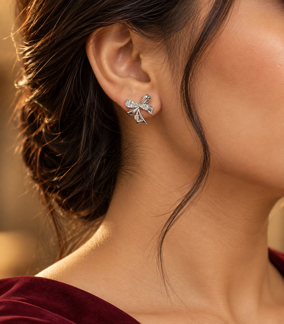JIMIKI Asymmetric Crystal Bow Stud Earring Pair in Silver / Clear, editorial model view #color_silver / clear