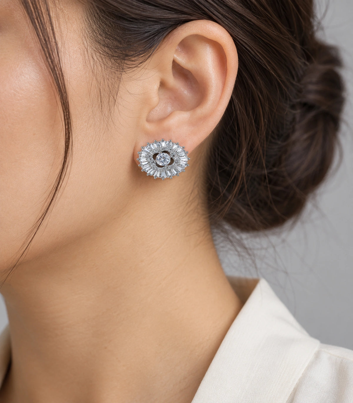 JIMIKI Baguette Halo Round Crystal Stud Earring Pair in Silver Tone, model wearing view #color_silver tone