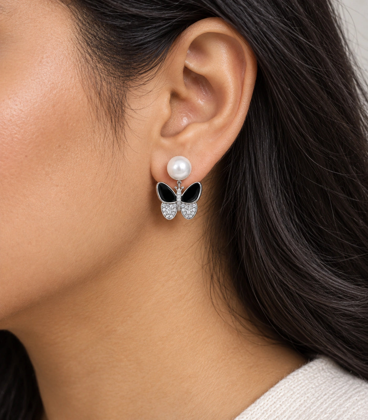 JIMIKI Silver Tone Black Enamel Butterfly Pearl Stud Earring Pair in Black / White Pearl / Silver, model wearing view