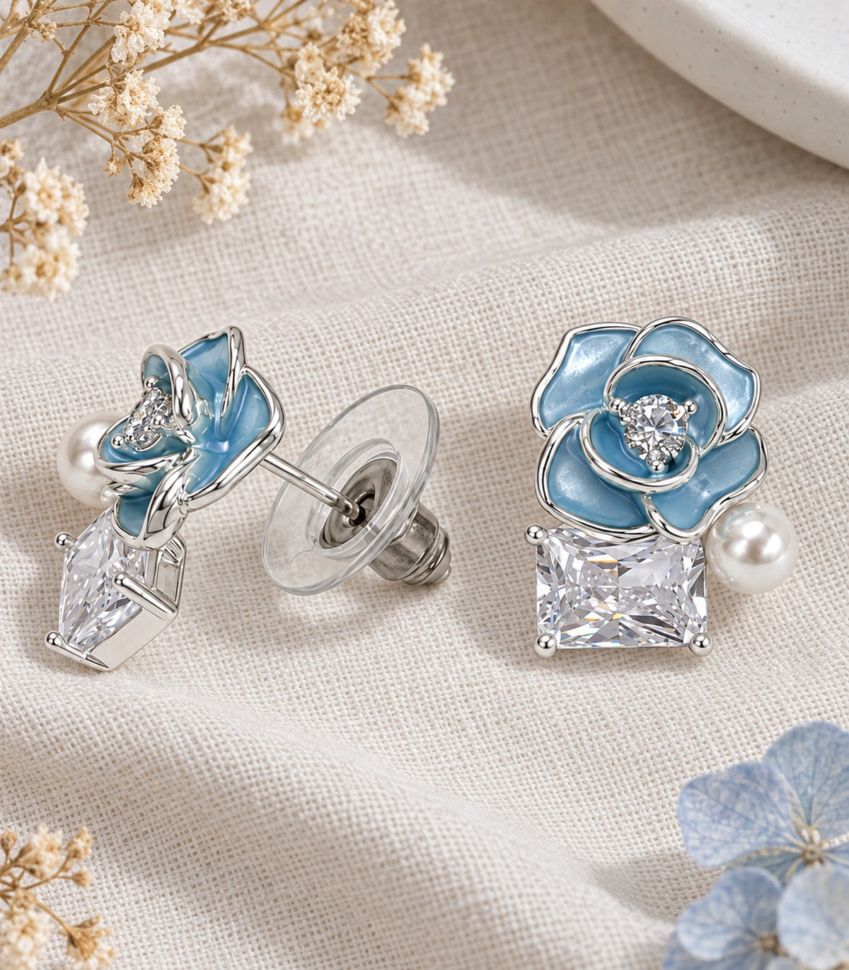 JIMIKI Flower Pearl Square Crystal Stud Earring Pair in Silver tone / Blue, editorial flat lay #color_silver tone / blue