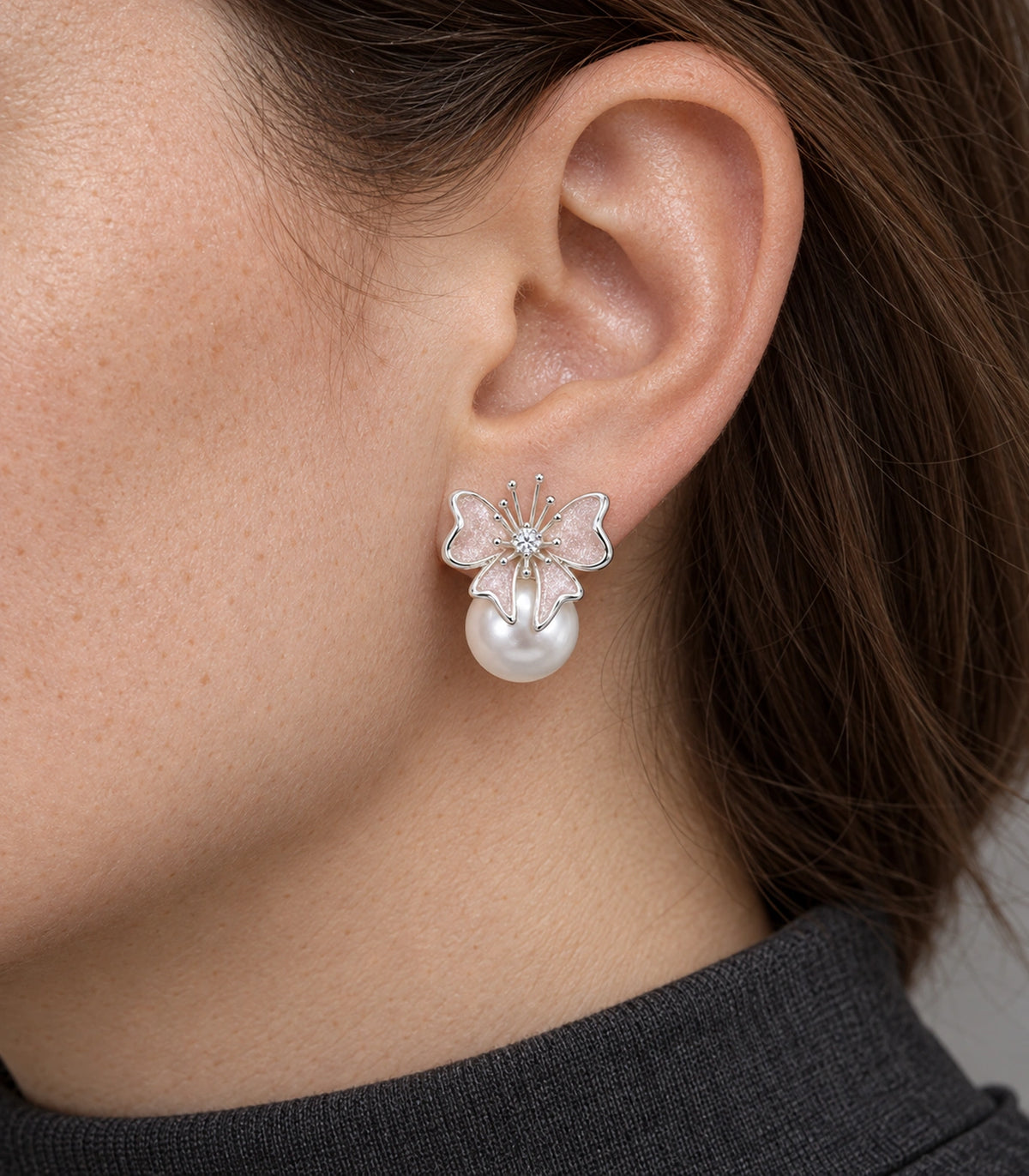 JIMIKI Butterfly Pearl Stud Earring Pair in Silver Tone / Blush, close-up detail #color_silver tone / blush
