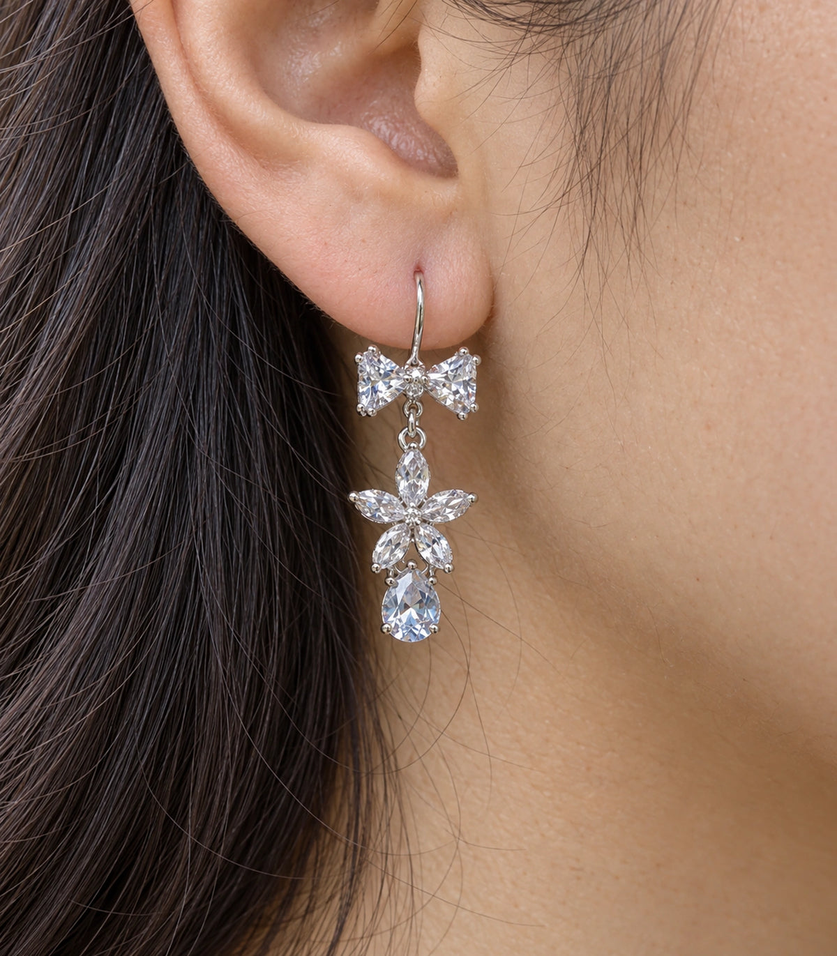 JIMIKI Silver-Tone Bow Flower Pear Drop Earrings in Silver-tone / clear, close-up detail