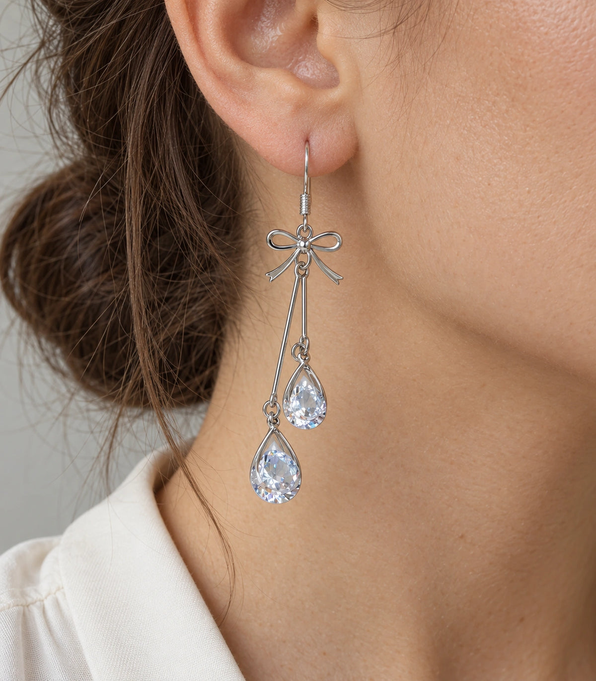 JIMIKI Silver Tone Bow Twin Pear Wire Drop Earring Pair in Silver-tone, close-up detail