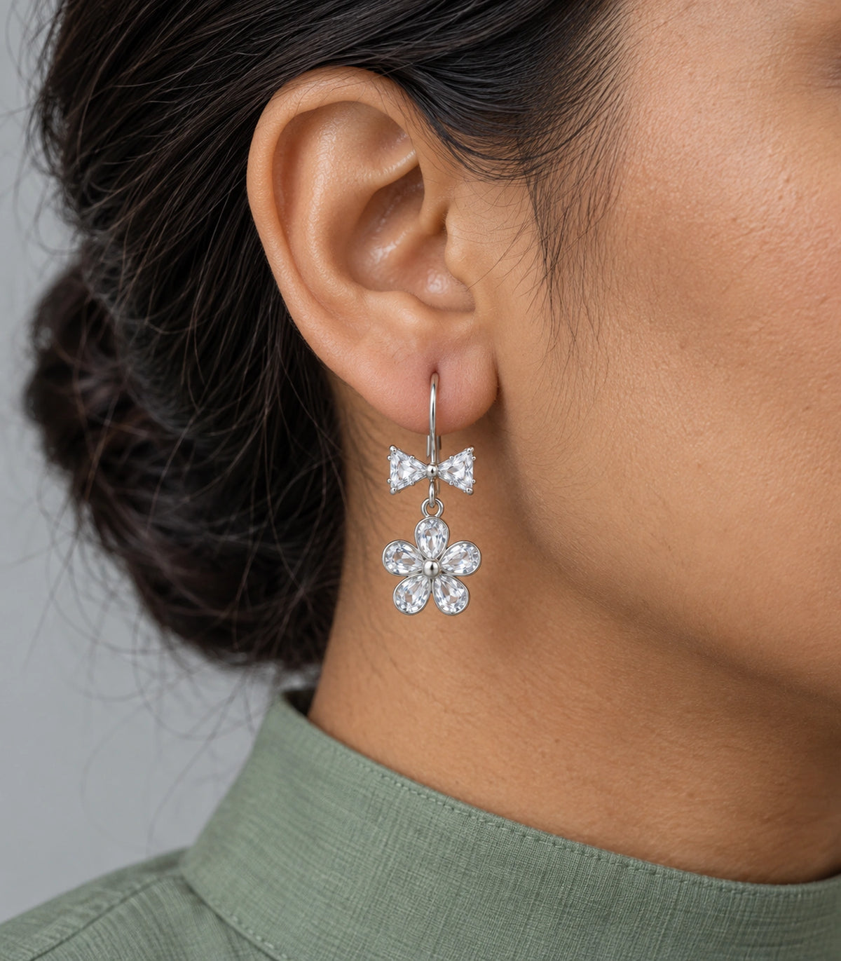 JIMIKI Silver Tone Clear Bow Five Petal Flower Drop Earring Pair in Silver tone / clear, close-up detail