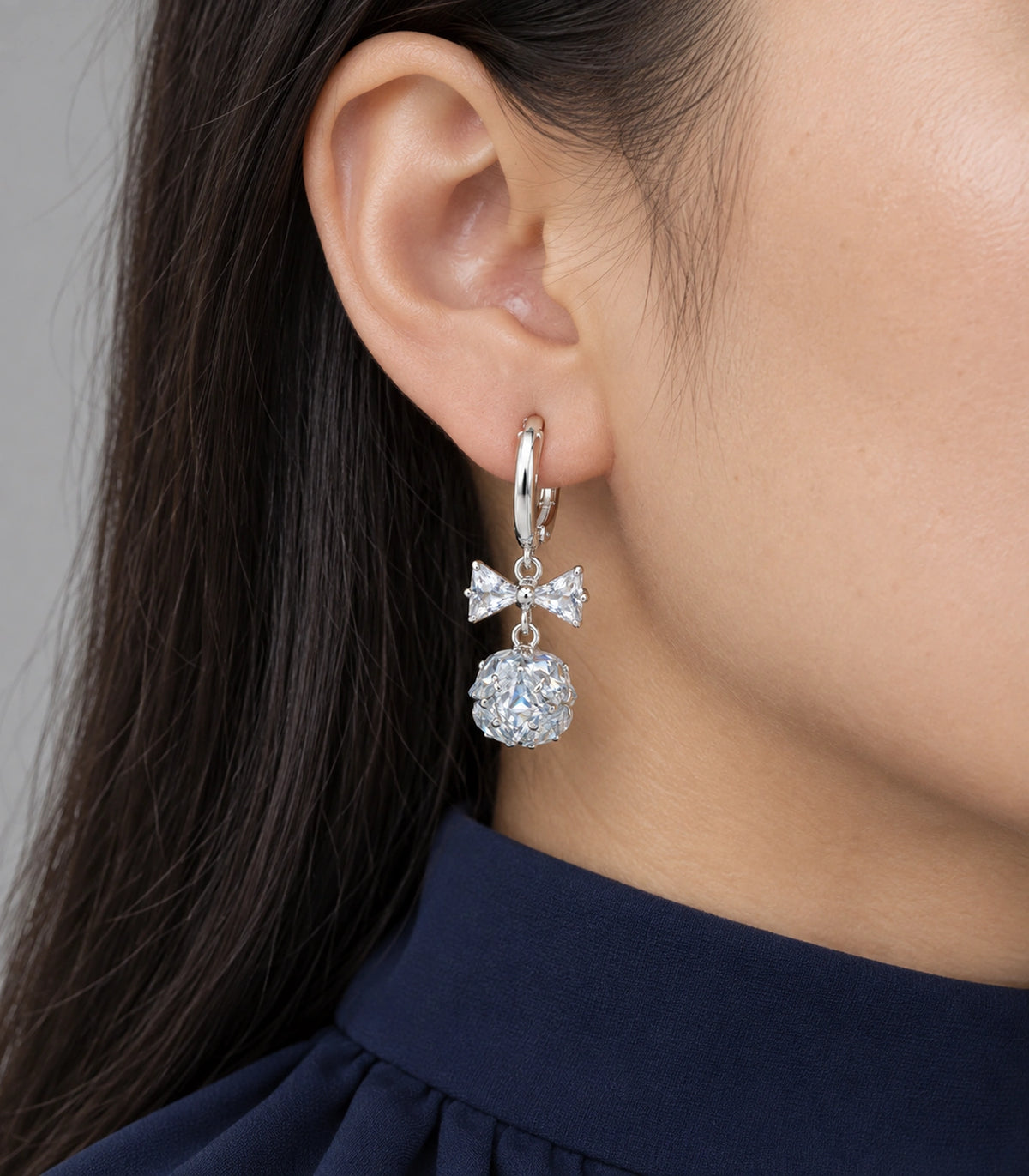 JIMIKI Silver Tone Clear Crystal Bow Cluster Ball Hoop Earring Pair in Silver tone / clear, close-up detail