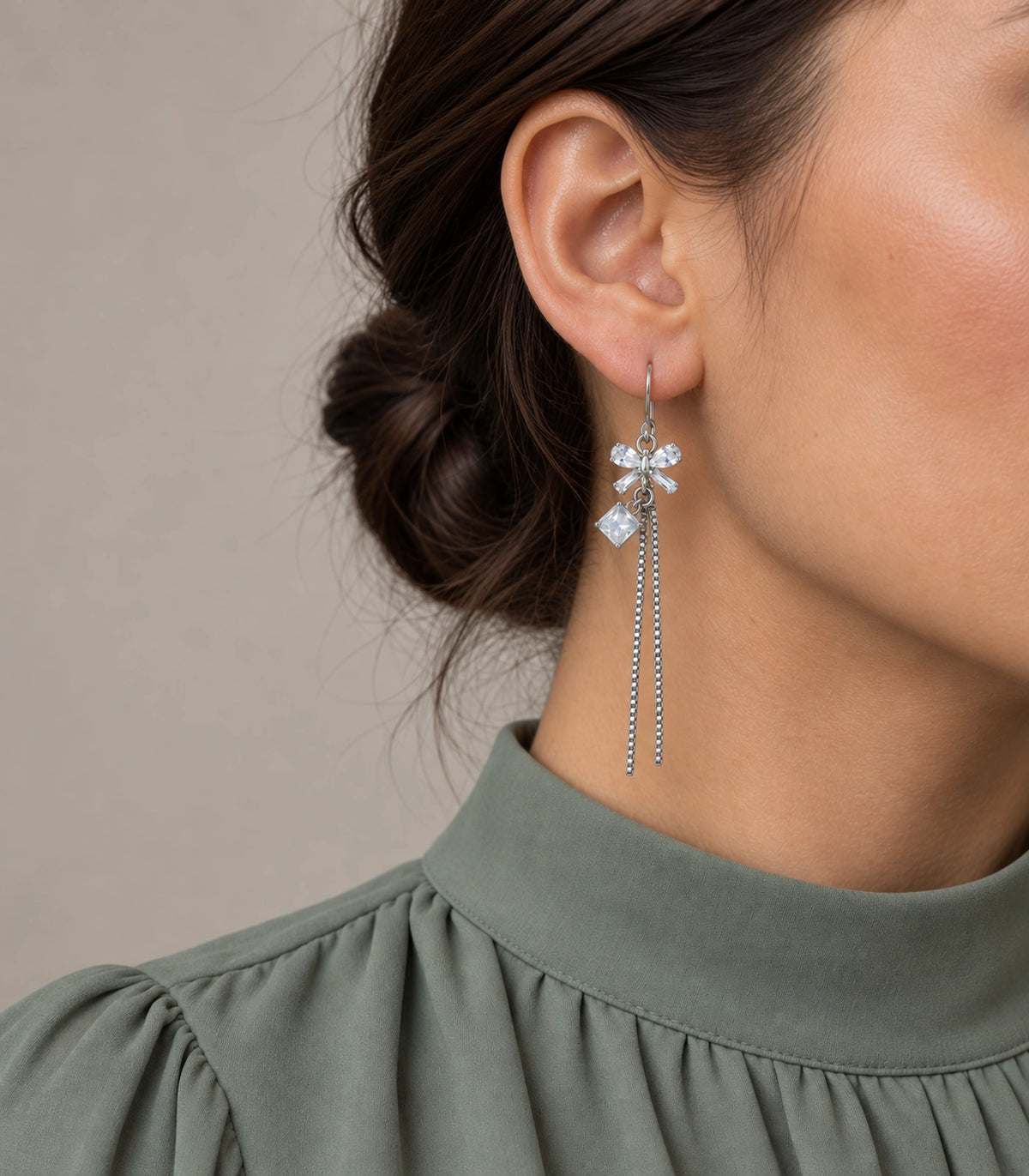 JIMIKI Silver Tone Clear Crystal Bow Square Chain Tassel Earring Pair in Silver tone / clear, model wearing view