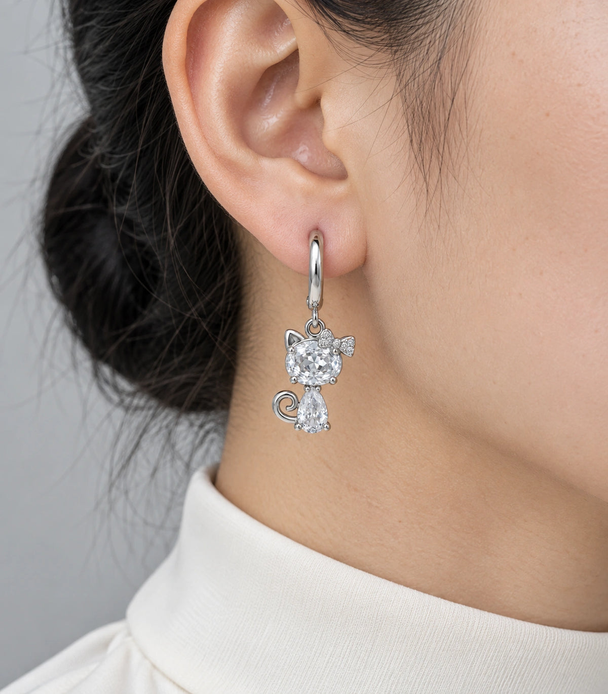JIMIKI Silver Tone Clear Crystal Cat Bow Hoop Earring Pair in Silver tone / clear, close-up detail