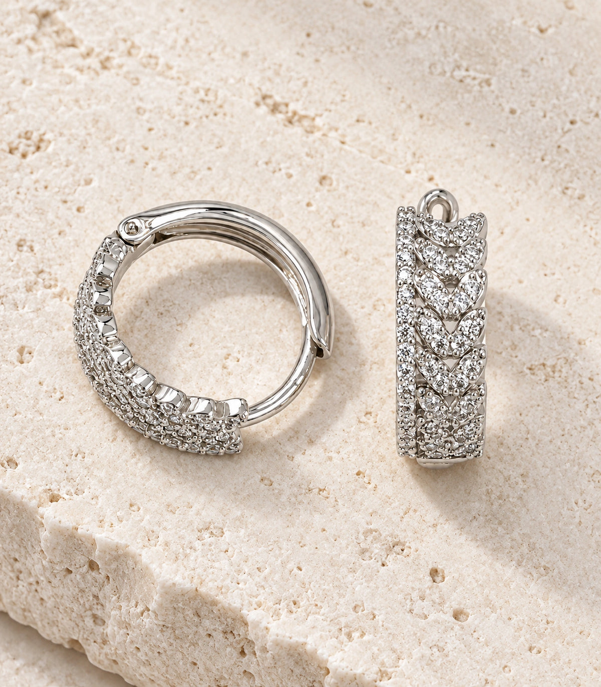 JIMIKI Crystal Chain Pattern Hoop Earring Pair in Silver tone/Clear, editorial flat lay #color_silver tone/clear