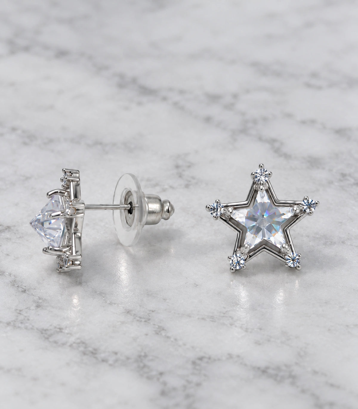 JIMIKI Crystal Star Stud Earring Pair in Silver tone, editorial flat lay #color_silver tone