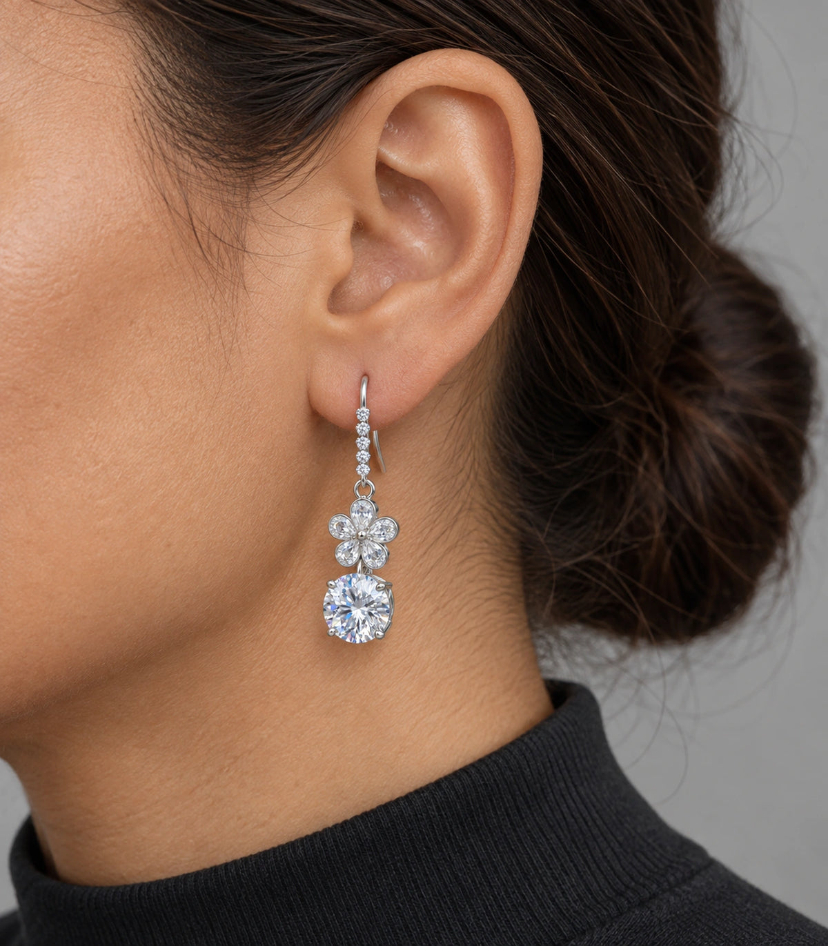 JIMIKI Silver Tone Clear Flower Round Solitaire Drop Earring Pair in Silver tone / clear, model wearing view