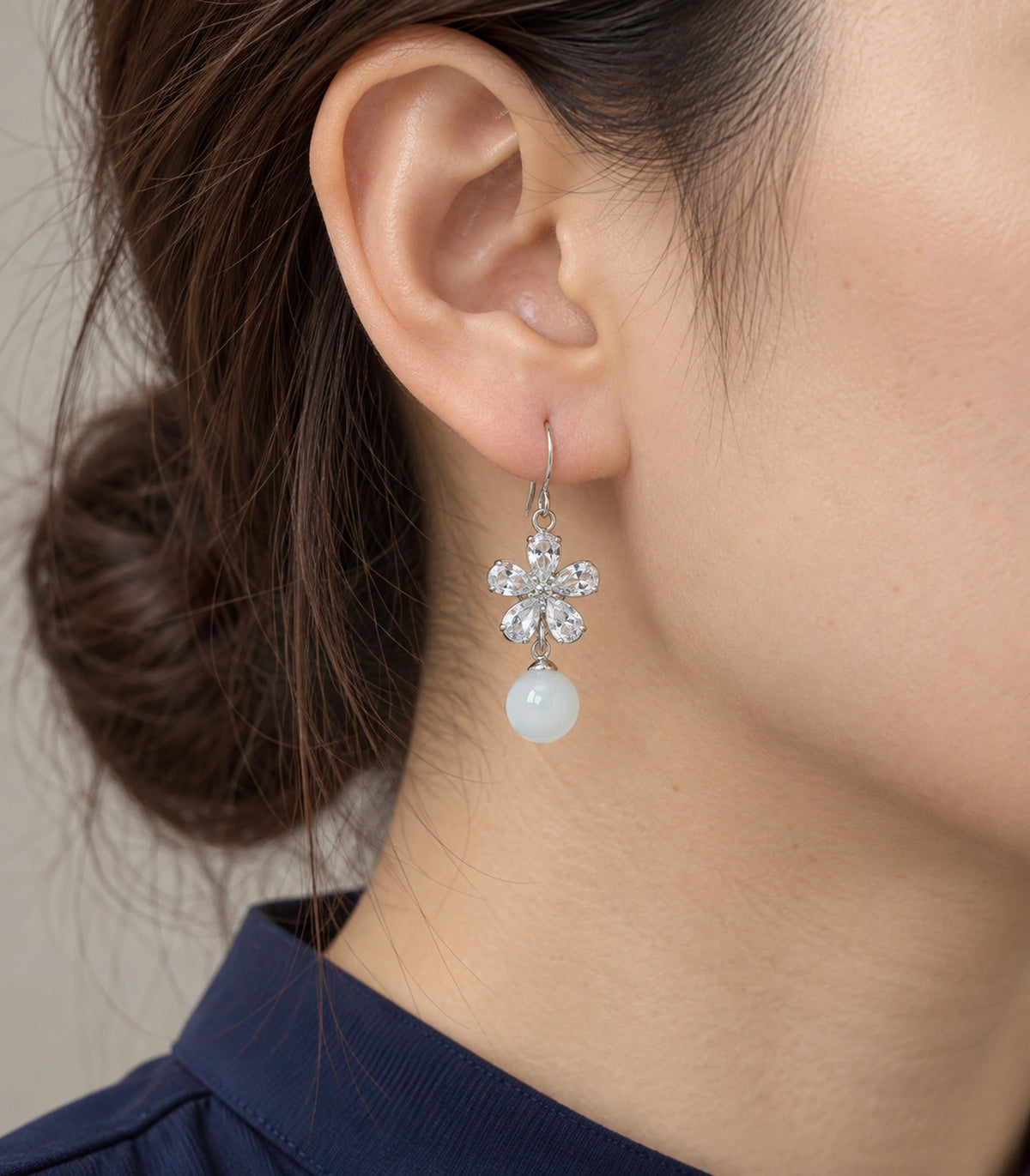 JIMIKI Silver Tone Clear Flower White Bead Drop Earring Pair in Silver-tone, close-up detail