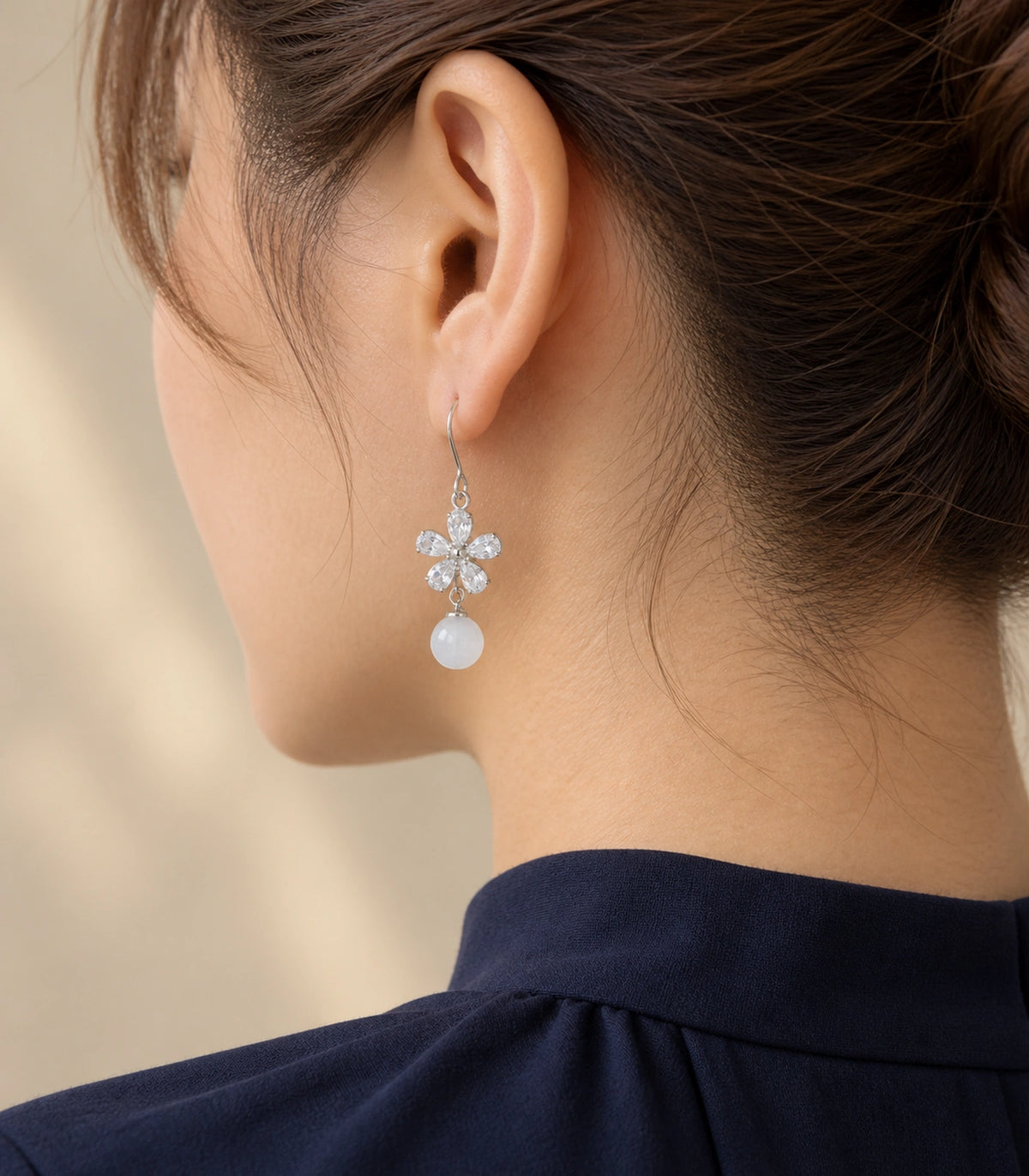 JIMIKI Silver Tone Clear Flower White Bead Drop Earring Pair in Silver-tone, editorial model view