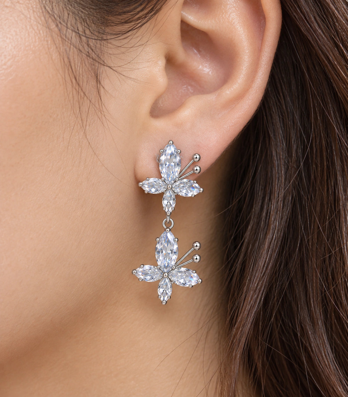 JIMIKI Silver Tone Clear Marquise Double Butterfly Drop Earring Pair in Clear / Silver, close-up detail