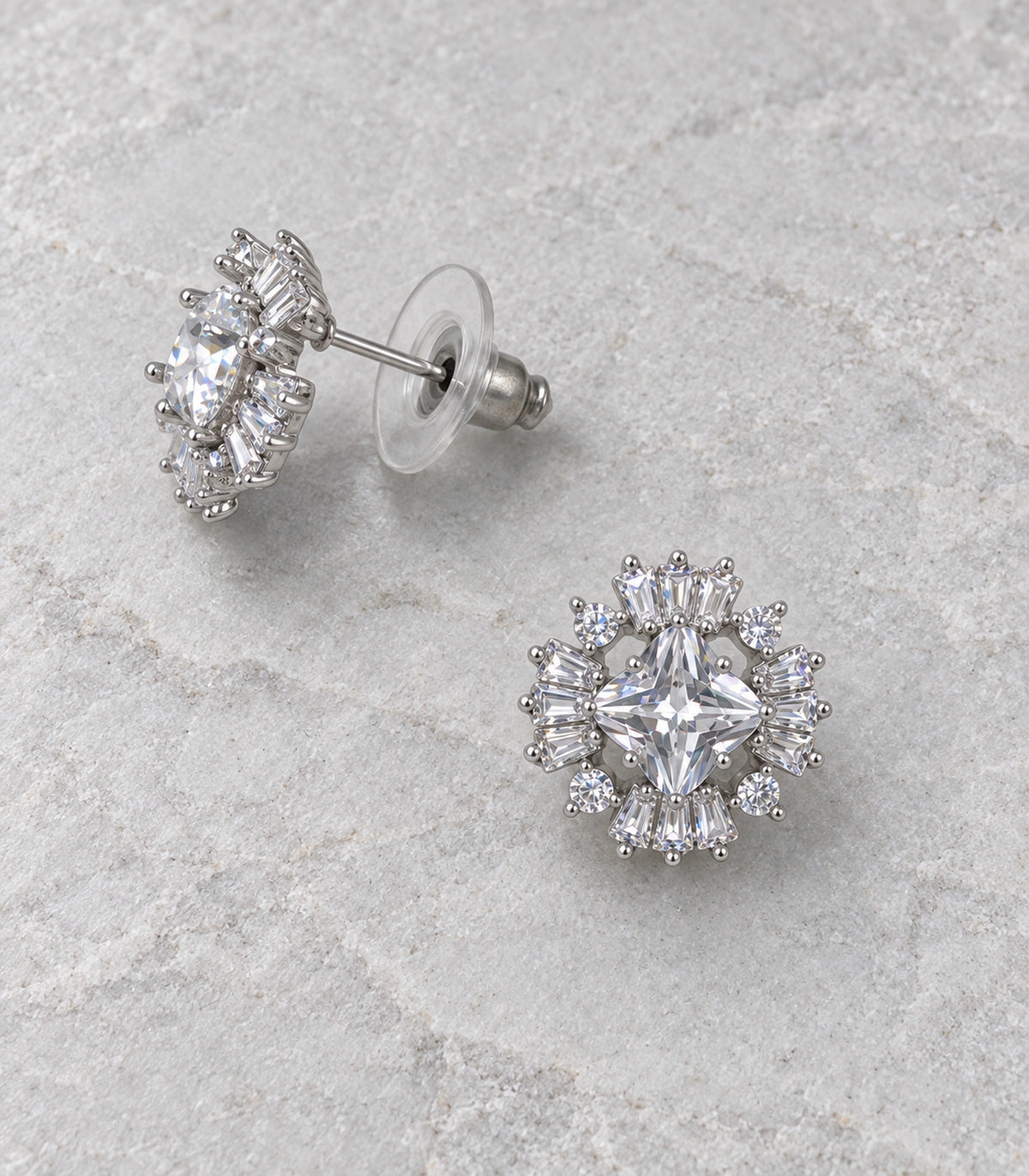 JIMIKI Star Crystal Baguette Halo Stud Earring Pair in Silver tone, editorial flat lay #color_silver tone