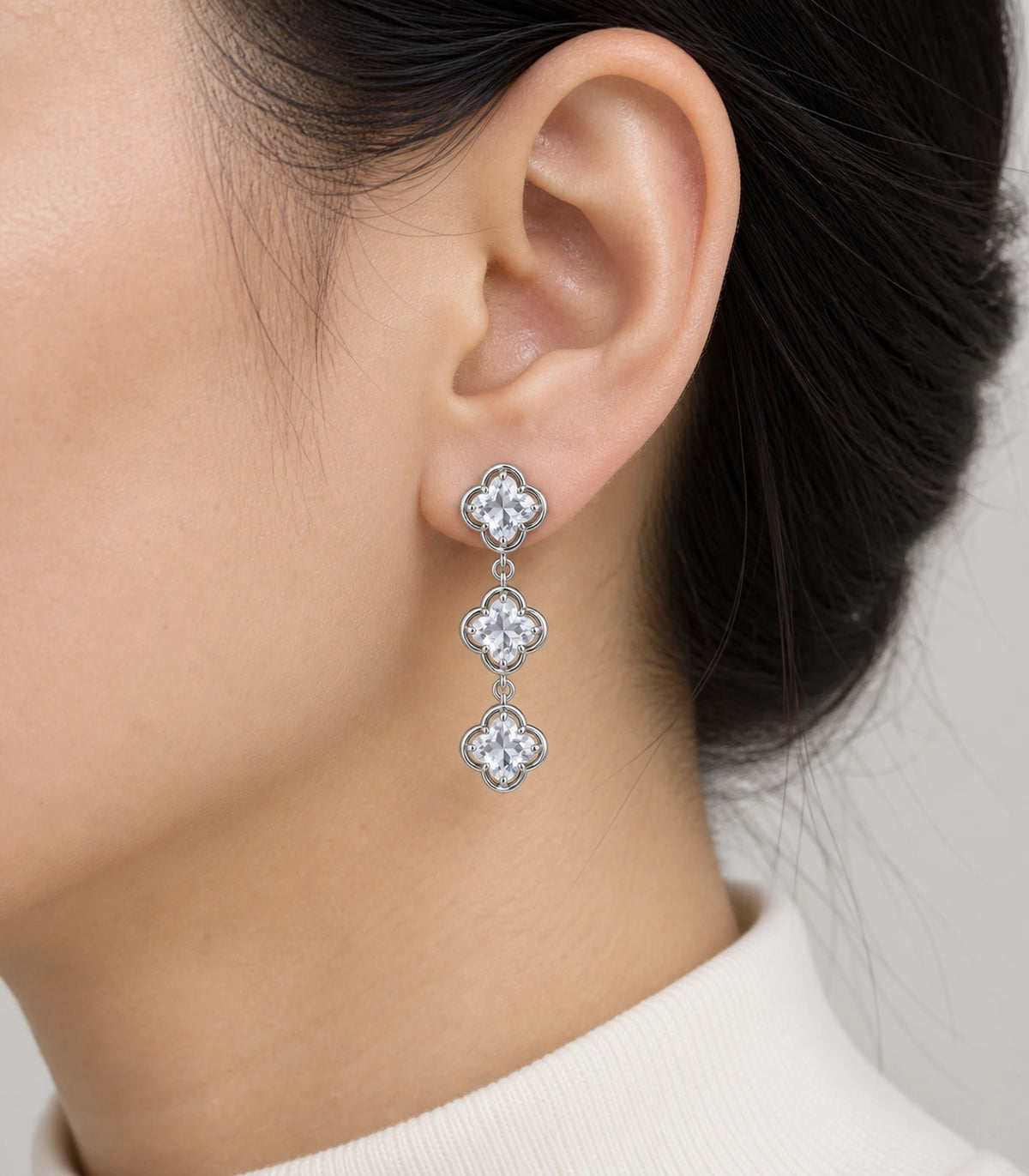 JIMIKI Triple Quatrefoil Crystal Drop Earring Pair in Silver tone / clear, close-up detail #color_silver tone / clear