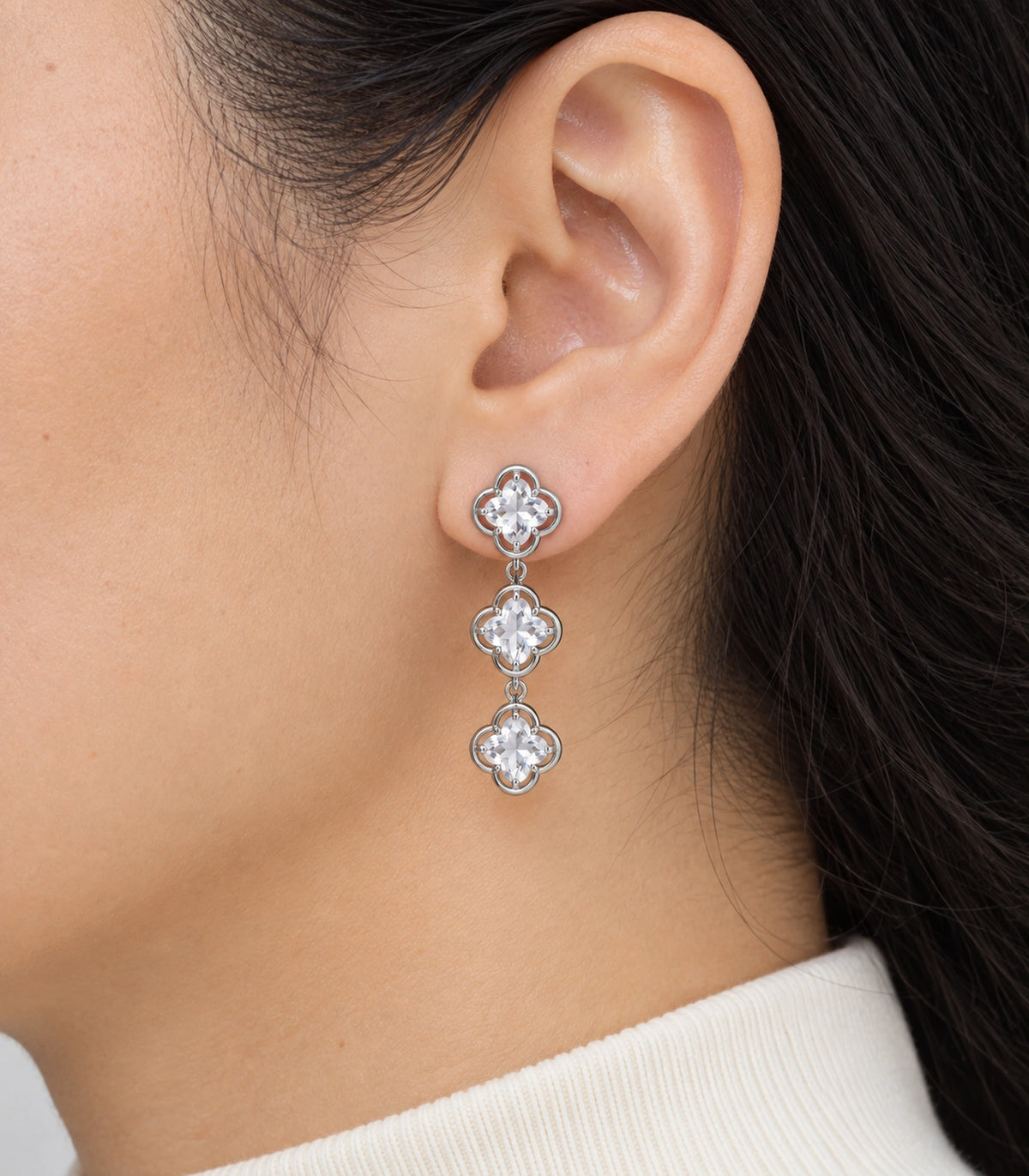 JIMIKI Triple Quatrefoil Crystal Drop Earring Pair in Silver tone / clear, model wearing view #color_silver tone / clear
