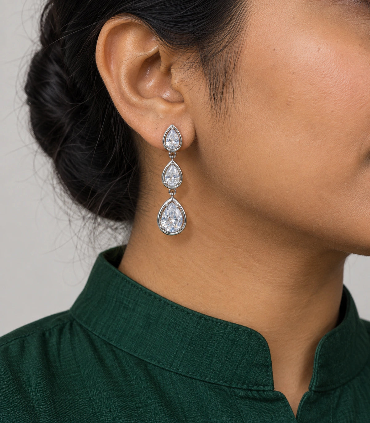 JIMIKI Silver Tone Clear Triple Teardrop Drop Earring Pair in Silver Tone, model wearing view