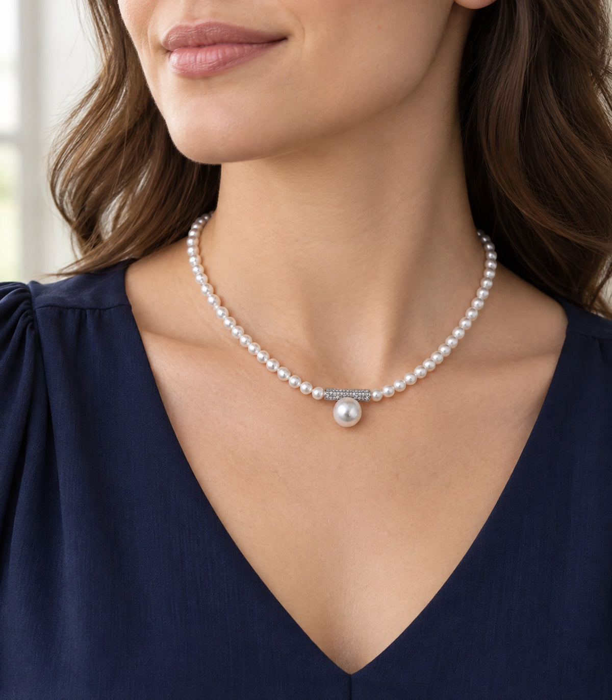 JIMIKI Silver Tone Crystal Bar Pearl Drop Necklace in Silver / White, editorial model view
