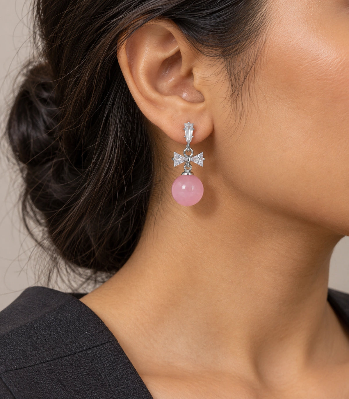 JIMIKI Silver-Tone Crystal Bow Pink Bead Drop Earrings in Silver / Clear / Pink, editorial model view