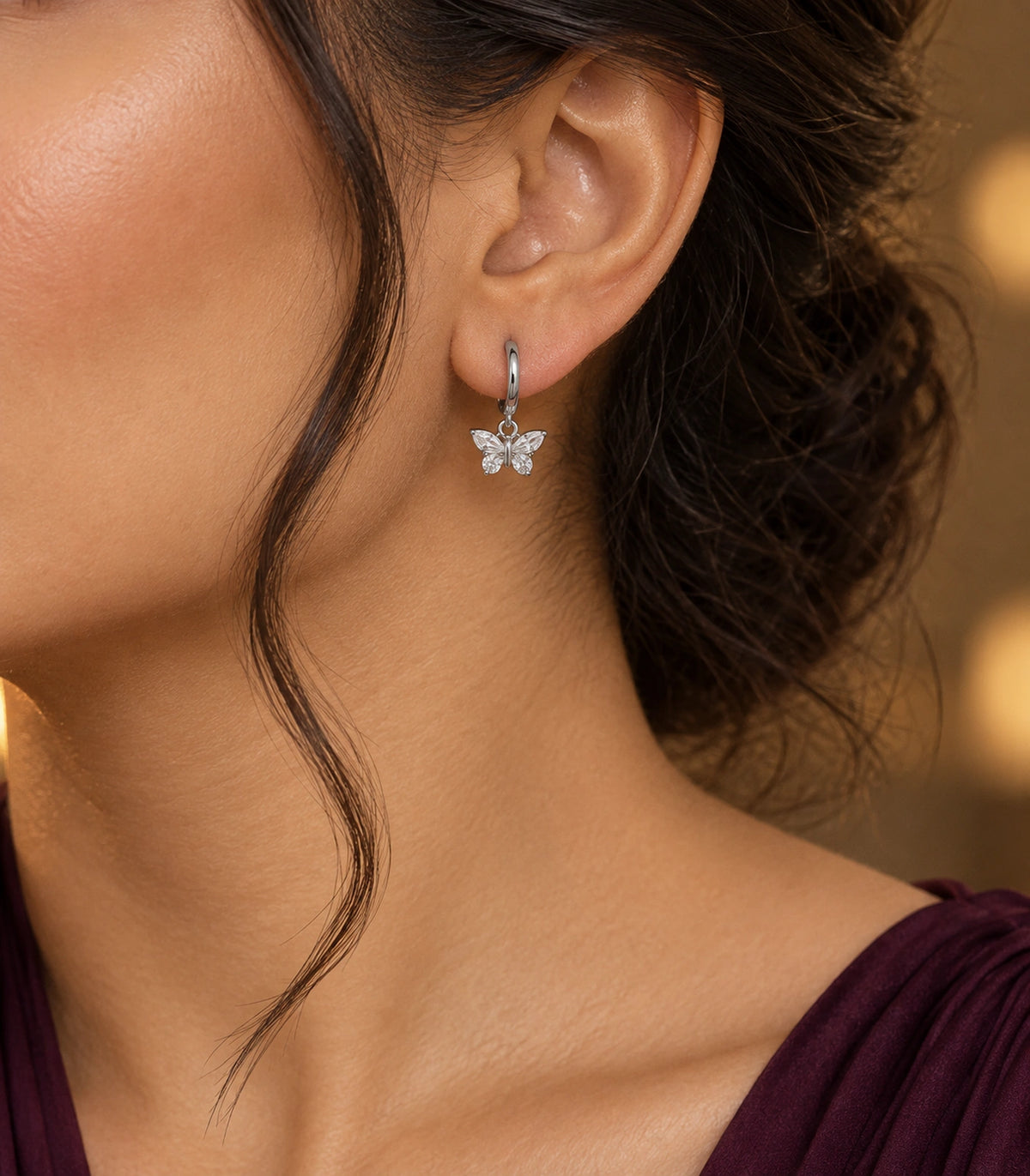 JIMIKI Crystal Butterfly Huggie Earrings in Silver / Clear, editorial model view #color_silver / clear
