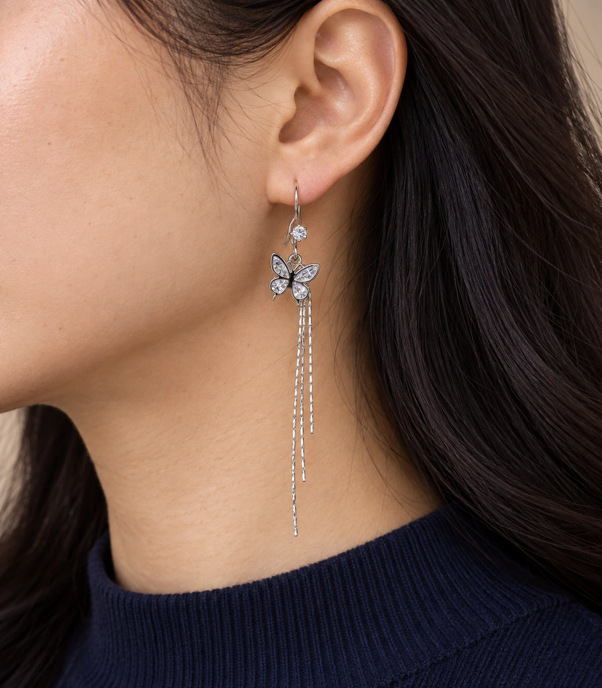 JIMIKI Silver Tone Crystal Butterfly Three Chain Earring Pair in Silver-tone, editorial model view