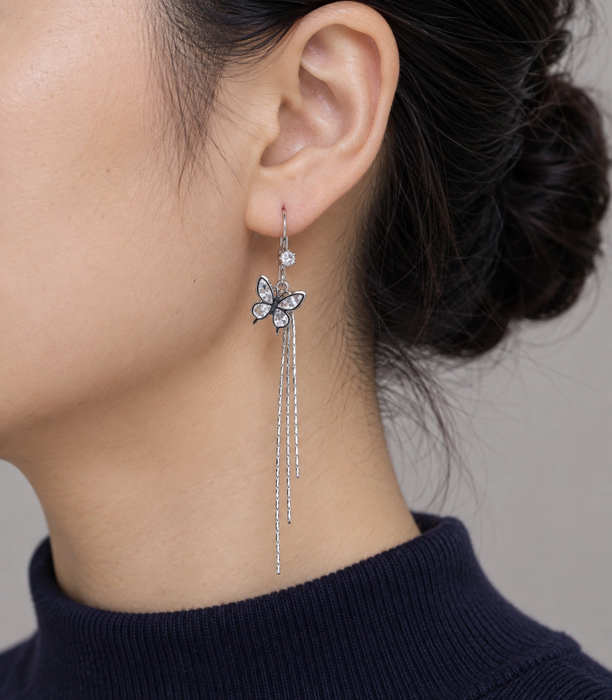 JIMIKI Silver Tone Crystal Butterfly Three Chain Earring Pair in Silver-tone, model wearing view
