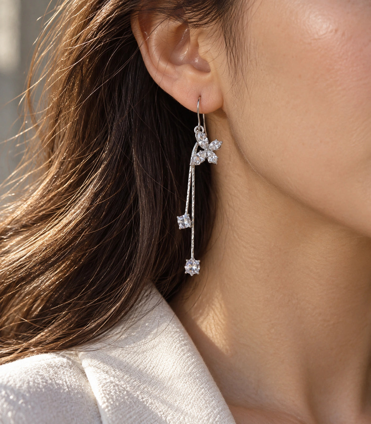 JIMIKI Silver Tone Crystal Butterfly Twin Square Chain Earring Pair in Silver-tone, editorial model view