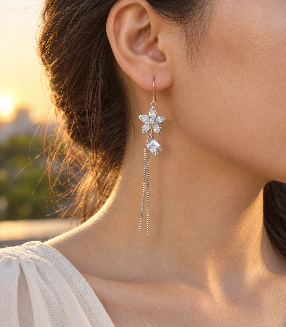JIMIKI Silver Tone Crystal Flower Square Chain Tassel Earring Pair in Silver tone, editorial model view
